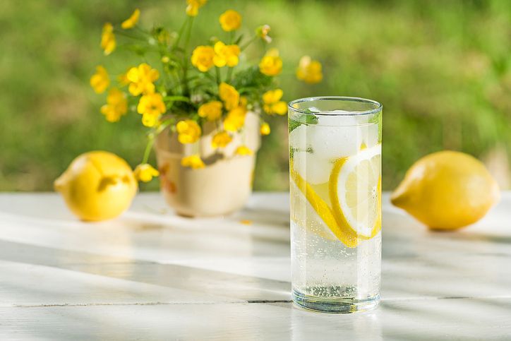 Lemon infused water with mint in glasses and jug.Healthy drink, detox, dieting beverage.