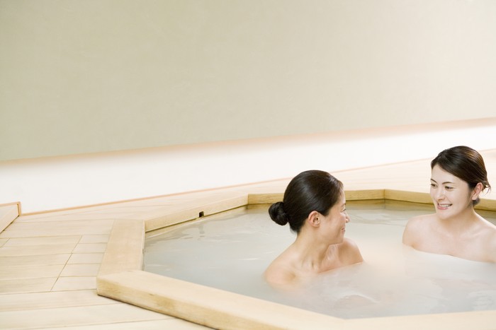 Two women taking bath together