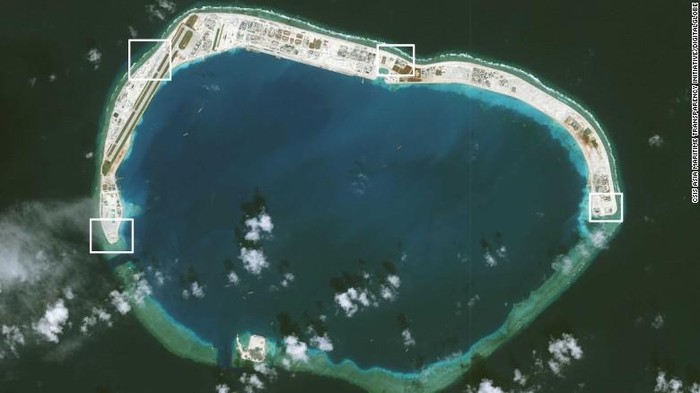 A satellite image of Mischief Reef taken on November 15. AMTI says two of the four structures have been completed, with covers already placed over the systems installed there. (CSIS Asia Maritime Transparency Initiative/Digital Globe)