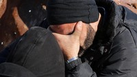 Tangisan warga Aleppo sebelum dievakuasi. REUTERS/Abdalrhman Ismail.