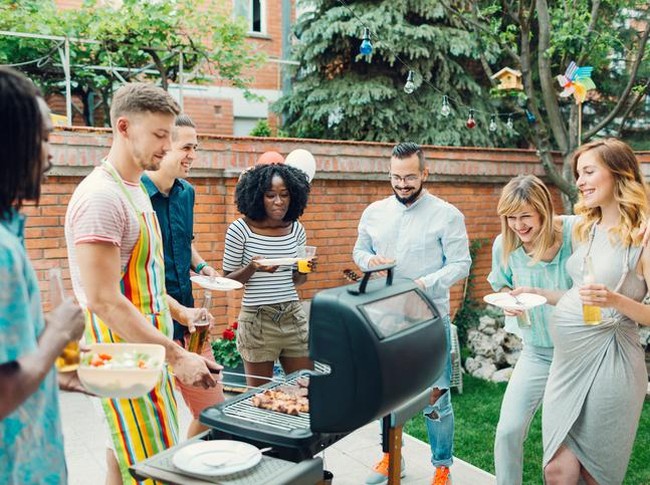 Cowboy chef has tri tip under control at large social gathering in desert location