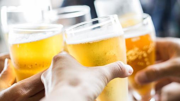 Friends toasting with beer