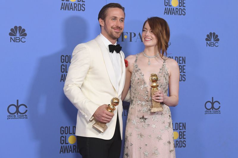 BEVERLY HILLS, CA - JANUARY 08:  Actors Ryan Gosling and Emma Stone, winners for Best Actor and Best Actress in a Musical or Comedy Film for 