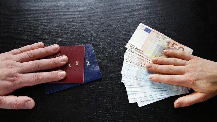 buying illegal foreign passport hands exchanging money and documents buyer seller