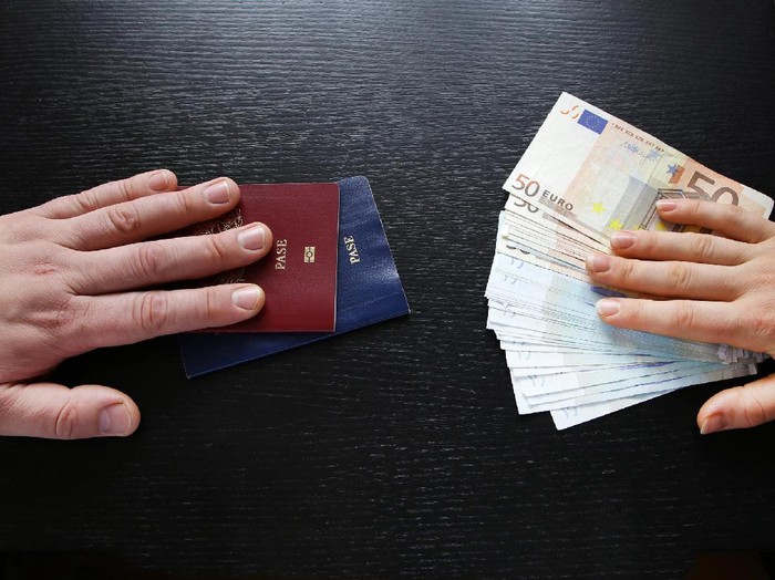 buying illegal foreign passport hands exchanging money and documents buyer seller