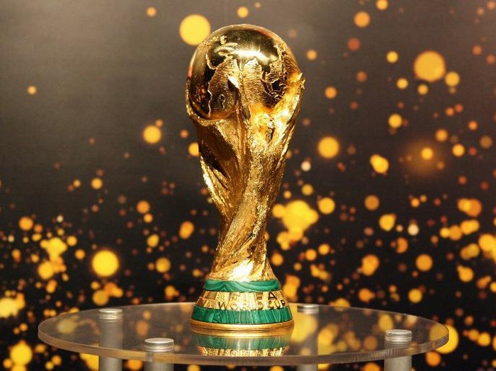 (FILES) This file photo taken on May 12, 2006 shows the FIFA World Cup trophy presented to the public in Berlin. 
FIFAs ruling council on January 10, 2017 unanimously approved an expansion of the World Cup to 48 teams in 2026, with a format of 16 groups of three nations. / AFP PHOTO / BARBARA SAX