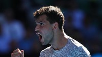 Grigor Dimitrov maju ke babak empat besar setelah menyisihkan unggulan 11 David Goffin (Belgia) dengan 6-3, 6-2, dan 6-4. Clive Brunskill/Getty Images.