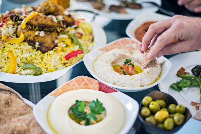 Dinning table filled with different mezze.
