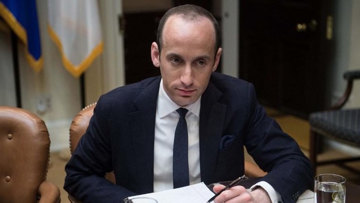 White House Senior Adviser Stephen Miller attends a meeting between US President Donald Trump and small business leaders in the Roosevelt Room at the White House in Washington, DC, on January 30, 2017. / AFP PHOTO / NICHOLAS KAMM