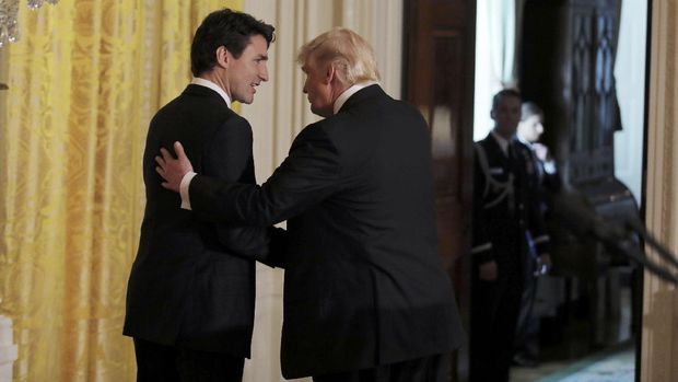 Pertemuan Pertama, Trump dan PM Kanada Berbeda Soal Pengungsi