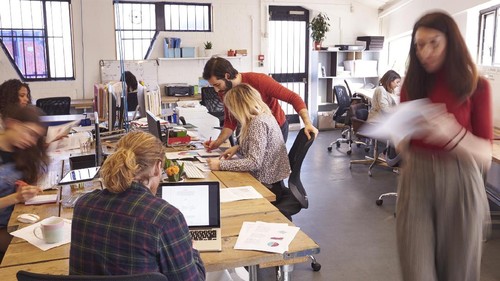 Young man and woman startups business meeting to discuss the situation on the marketing in the meeting room.