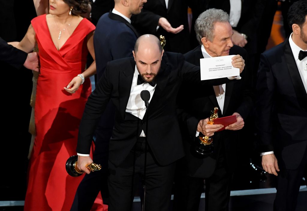 HOLLYWOOD, CA - FEBRUARY 26:  'La La Land' producer Jordan Horowitz holds up the winner card reading actual Best Picture winner 'Moonlight' with actor Warren Beatty onstage during the 89th Annual Academy Awards at Hollywood & Highland Center on February 26, 2017 in Hollywood, California.  (Photo by Kevin Winter/Getty Images)