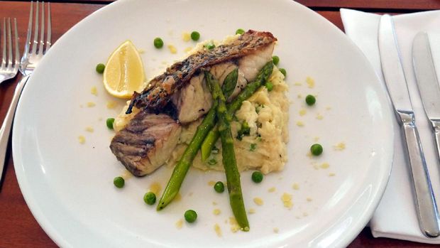 Hasil masakan saya, risotto dengan ikan barramundi panggang. Enak lho! (Wahyu/detikTravel)