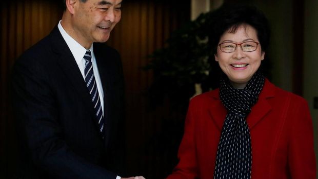 Chief Executive Carrie Lam (R) meets current leader Leung Chun-ying in Hong Kong, China March 27, 2017