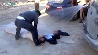 Para relawan berusaha menyelamatkan salah satu korban dengan menyemprotkan air. Social Media Website via Reuters TV.