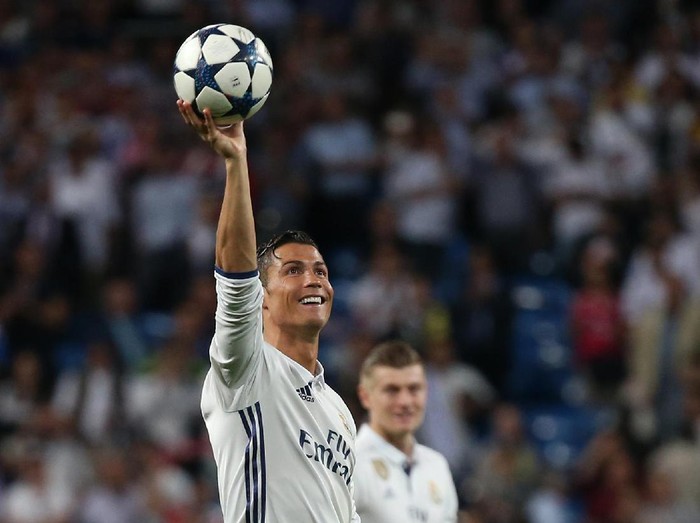 Football Soccer - Real Madrid v Bayern Munich - UEFA Champions League Quarter Final Second Leg - Estadio Santiago Bernabeu, Madrid, Spain - 18/4/17 Real Madrid's Cristiano Ronaldo celebrates after the game with the match ball after scoring a hat trick Reuters / Sergio Perez Livepic