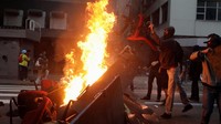 Organisasi buruh menyebut pemogokan ini sebagai protes untuk mengusulkan reformasi jaminan pensiun. Presiden Michel Temer mengatakan dia menyesalkan insiden di Rio, Tetapi dia menekankan bahwa dia akan melanjutkan upayanya untuk memodernisasi negara. REUTERS/Ricardo Moraes.
