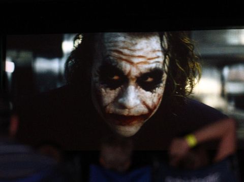 PERTH, AUSTRALIA - FEBRUARY 12:  Film goers watch The Dark Knight featuring Heath Ledger during a public tribute outdoor movie night to the late actor at Burswood Park on February 12, 2011 in Perth, Australia. Australian actor Heath Ledger won a posthumous Oscar for his portrayal of the Joker in the movie The Dark Knight. Ledger died from an accidental toxic combination of prescription drugs on January 22, 2008. (Photo by Paul Kane/Getty Images)