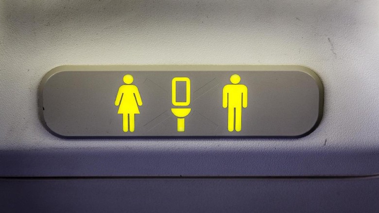 Ilustrasi tanda toilet di pesawat