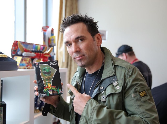 SAN DIEGO, CA - JULY 25:  Jason David Frank, from the iconic Mighty Morphin Power Rangers, checks out his Limited Edition Tokyo Vinyl Green Ranger at the Power Rangers media suite at San Diego Comic-Con International on July 25, 2014 in San Diego, CA.  (Photo by Chelsea Lauren/Getty Images for Saban Brands)