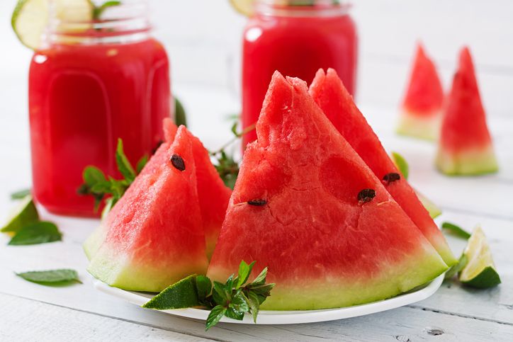 Fresh mojito with watermelon on a wooden table