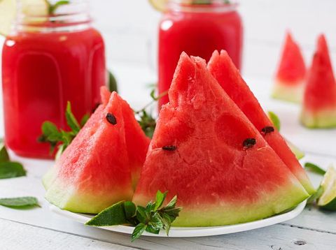 Fresh mojito with watermelon on a wooden table