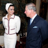 Sheikha Mozah bint Nasser Al-Missned and Prince Charles, Prince of Wales walk together after visiting students from His Royal Highness Prince Charles School of Traditional Arts at Clarence House on 27 October, 2010 in London, England. Sheikh Hamad bin Khalifa al-Thani and his wife are on a three-day state visit to the UK and are due to visit the 2012 Olympics site later today.  (Photo by Jane Mingay - WPA Pool/Getty Images)