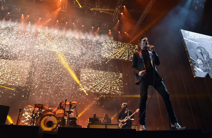 LAS VEGAS, NEVADA - APRIL 06:  (L-R) Musicians Ronnie Vannucci, Jr., Mark Stoermer and Brandon Flowers of The Killers perform onstage during the grand opening of T-Mobile Arena on April 6, 2016 in Las Vegas, Nevada.  (Photo by Kevin Winter/Getty Images for ABA)