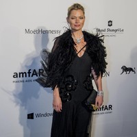 Kate Moss arrives on the red carpet during the 2015 amfAR Hong Kong gala at Shaw Studios on March 14, 2015 in Hong Kong.  (Photo by Moses Ng/Getty Images)