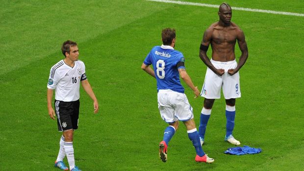 WARSAW, POLAND - JUNE 28:  Mario Balotelli (R) of Italy celebrates with team-mate Claudio Marchisio after scoring his team's second goal as Philipp Lahm of Germany shows his dejection during the UEFA EURO 2012 semi final match between Germany and Italy at the National Stadium on June 28, 2012 in Warsaw, Poland.  (Photo by Michael Regan/Getty Images)