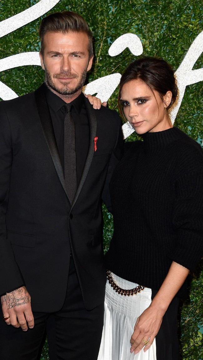David and Victoria Beckham attend the British Fashion Awards at London Coliseum on December 1, 2014 in London, England.  (Photo by Pascal Le Segretain/Getty Images)