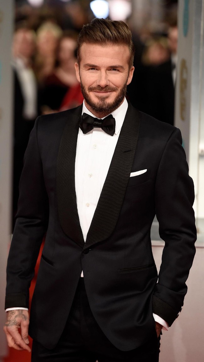 David Beckham memiliki wajah tegas yang begitu maskulin. Suami Victoria Beckham itu pun dinilai memiliki ketampanan yang bikin hati wanita meleleh. Foto: Getty Images