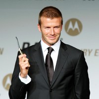 David Beckham holds Motorolas mobile phone Luxury Gold RAZR2 during a promotion for Motorola at the Westin Chosun Hotel on February 28, 2008 in Seoul, South Korea.  (Photo by Chung Sung-Jun/Getty Images)