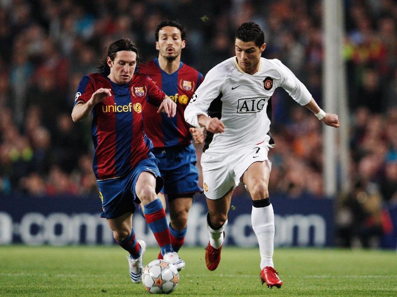 BARCELONA, SPAIN - APRIL 23:  Cristiano Ronaldo (R) of Manchester United holds off the challenge of Lionel Messi (L) of Barcelona during the UEFA Champions League Semi-Final, first leg match between Barcelona and Manchester United at the Camp Nou stadium on April 23, 2008 in Barcelona, Spain.  (Photo by Jasper Juinen/Getty Images)