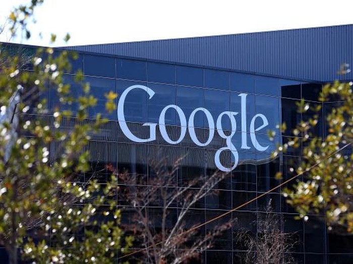 MOUNTAIN VIEW, CA - JULY 17:  A bicyclist rides by a sign outside of the Google headquarters July 17, 2008 in Mountain View, California. Google Inc. is expected to announce an increase in quarterly profits when it reports its quarterly earnings today after the closing bell.  (Photo by Justin Sullivan/Getty Images)