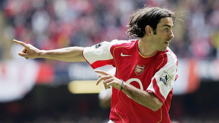 CARDIFF, UNITED KINGDOM - APRIL 16: Robert Pires of Arsenal celebrates scoring the opening goal during the FA Cup Semi-Final match between Arsenal and Blackburn Rovers at the Millennium Stadium on April 16, 2005 in Cardiff, Wales.  (Photo by Mike Hewitt/Getty Images)