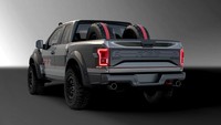 Ford menambahkan pikap ini dengan warna abu-abu dan tambahan pinstriping merah serta tulisan F-22 di bagian samping. Kesan tangguh ala pesawat tempur F-22 Raptor juga bisa dilihat dari bagian grille depan dan lampu di spion samping. Pada pikap ini juga terdapat trim eksterior serat karbon, lampu LED di atap dan emblem F-22 di bagian belakang. Foto: Paultan