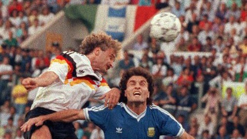 ROME, ITALY:  (FILES) A file picture taken 08 July 1990 shows German forward Rudi Voeller (L) heading for the ball against Argentinian defender Oscar Ruggeri as German forward Juergen Klinsmann (R) looks on during the World Cup final between West Germany and Argentina in Rome. Voeller announced 23 June 2004 he was resigning following Germanys elimination from Euro 2004. After long consideration, I have decided to step down, Voeller told a press conference at Germanys tournament base in Almancil, Portugal.   AFP PHOTO  GEORGES GOBET  (Photo credit should read GEORGES GOBET/AFP/Getty Images)