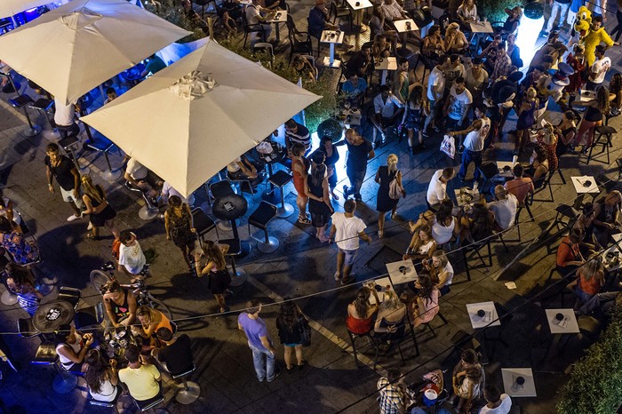 IBIZA, SPAIN - AUGUST 22:  General view of the atmosphere at the Marina on August 22, 2013 in Ibiza, Spain. The small island of Ibiza lies within the Balearics islands, off the coast of Spain. It has, for many years, had a reputation as a party destination. Each year thousands of young people gather to enjoy not only the hot weather and the beaches but also the array of clubs with international DJs playing to vast audiences. Ibiza has also gained a reputation for drugs and concerns are now growing that the taking and trafficking of drugs is spiralling out of control.  (Photo by David Ramos/Getty Images)