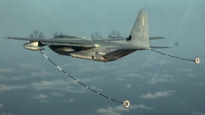 A KC-130 Hercules with Marine Medium Helicopter Squadron 364 (Rein.), 15th Marine Expeditionary Unit, prepares to refuel a CH-53E Super Stallion during air refueling training in the U.S. 5th Fleet area of responsibility, March 14, 2013. Picture taken March 14, 2013  U.S. Marine Corps photo by Cpl. John Robbart III/Handout via REUTERS   ATTENTION EDITORS - THIS IMAGE WAS PROVIDED BY A THIRD PARTY.