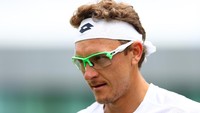 Denis Istomin mundur di babak pertama saat melawan Donald Young karena cedera lutut. Foto: Michael Steele/Getty Images