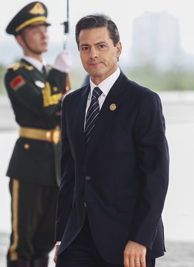 Presiden Meksiko Enrique Pena Nieto. Pria-pria Meksiko dikenal dengan ketampanannya, begitu pula Presiden Meksiko ke-62 ini. Enrique juga termasuk pemimpin dunia yang masih muda, usia 52 tahun. Foto: Getty Images