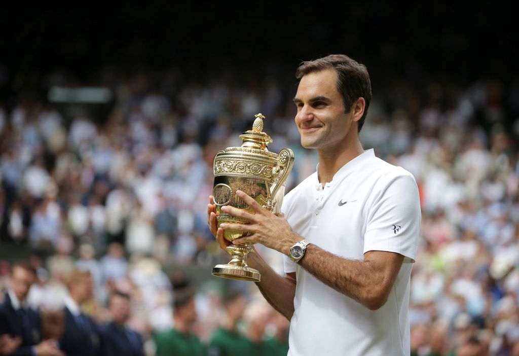 Roger Federer Tennis - Wimbledon - London, Britain - July 16, 2017 Switzerland's Roger Federer poses with the trophy as he celebrates winning the final against Croatia's Marin Cilic REUTERS/Daniel Leal-Olivas/Pool