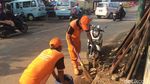 Foto: Melihat Kerja Pasukan Oranye dkk yang Disebut Malas-malasan