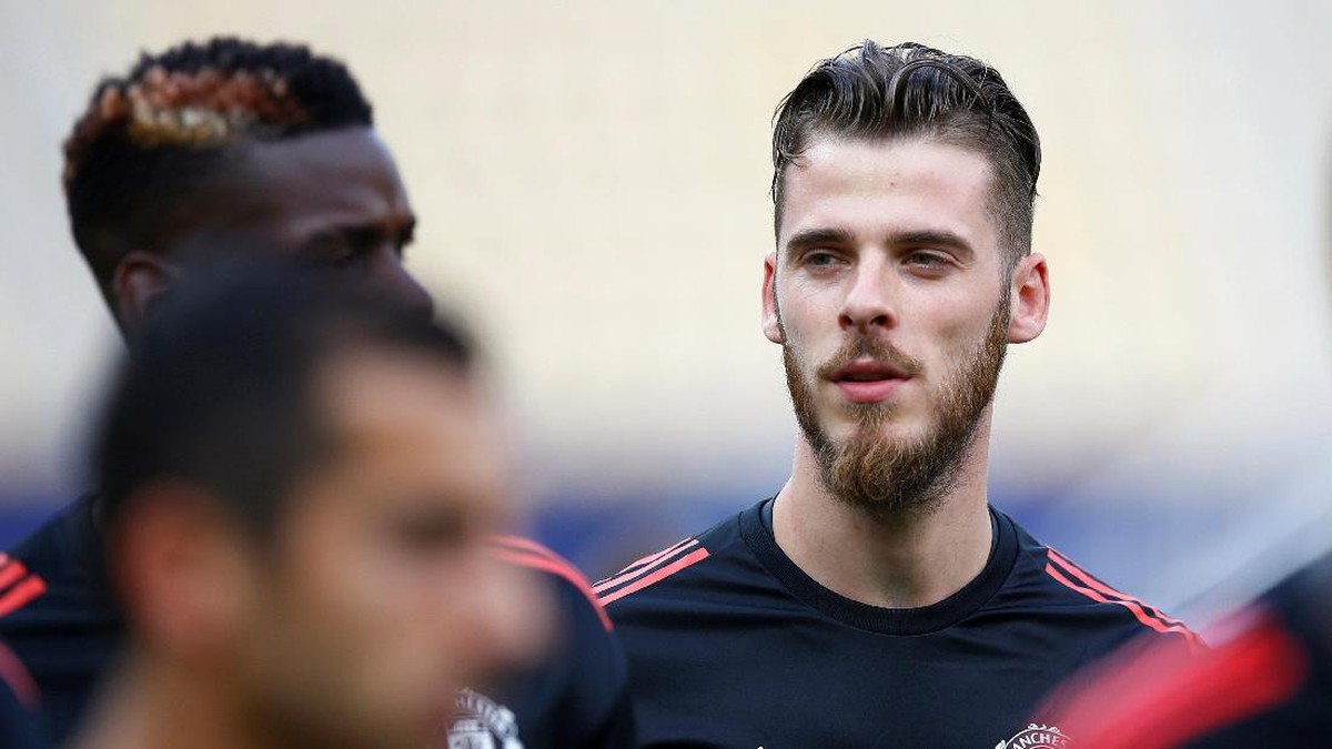 David de Gea akan bertahan lama di MU jika klub tersebut terus memenangi gelar (REUTERS/Peter Cziborra)