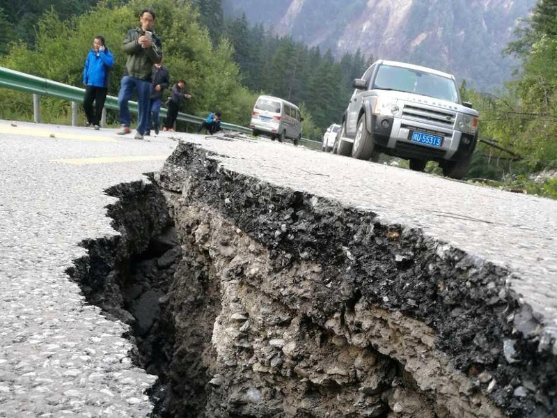 Stranded passengers rest at the departure hall of Jiuzhaigou airport near the remote, mountainous area struck by a deadly earthquake in Sichuan province, China August 9, 2017. REUTERS/Thomas Peter