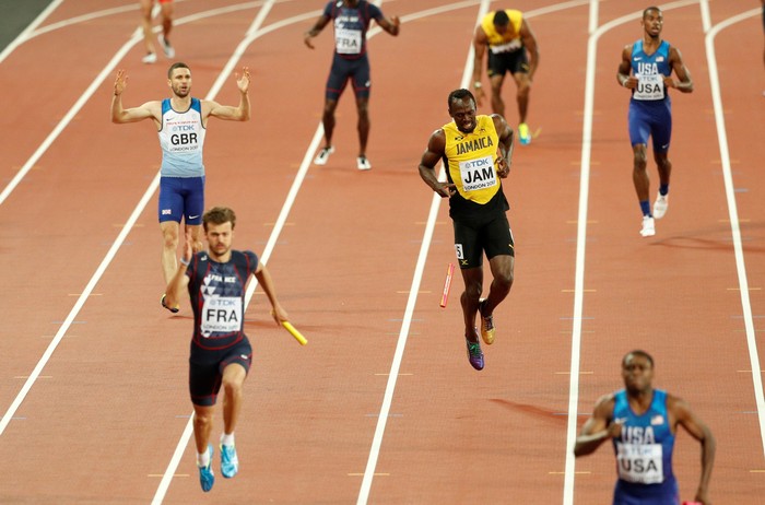 Athletics - World Athletics Championships – men’s 4 x 100 meters relay final – London Stadium, London, Britain – August 12, 2017 – Usain Bolt of Jamaica stumbles injured. REUTERS/John Sibley     TPX IMAGES OF THE DAY