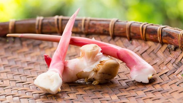 Thai tom yum soup with shrimp isolated on a wood table