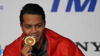 I Gede Siman Sudartawa menjadi pembuka lumbung emas untuk renang. Dia sekaligus mendonasikan emas ketujuh bagi Indonesia dari nomor 50m gaya punggung. Siman juga cetak rekor SEA Games. (Sigid Kurniawan/Antara Foto)