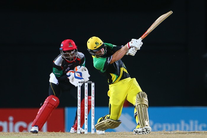 BASSETERRE, SAINT KITTS AND NEVIS - AUGUST 21: In this handout image provided by CPL T20, Glenn Phillips of the Jamaica Tallawahs on the attack as Devon Thomas looks on during Match 20 of the 2017 Hero Caribbean Premier League between St Kitts and Nevis v Jamaica Tallawahs at Warner Park on August 21, 2017 in Basseterre, St Kitts. (Photo by Ashley Allen - CPL T20 via Getty Images)